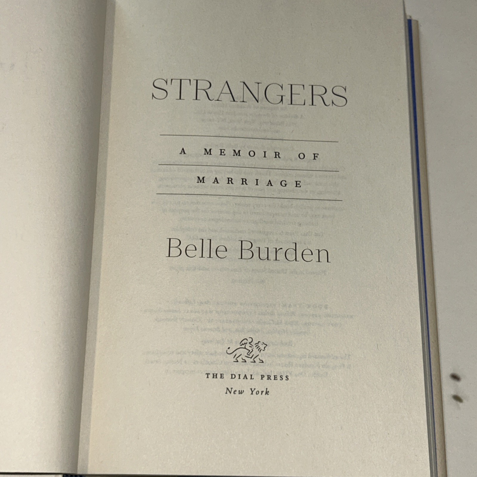 Strangers: A Memoir of Marriage, Burden, Belle . Hardcover. Used Good Conditions