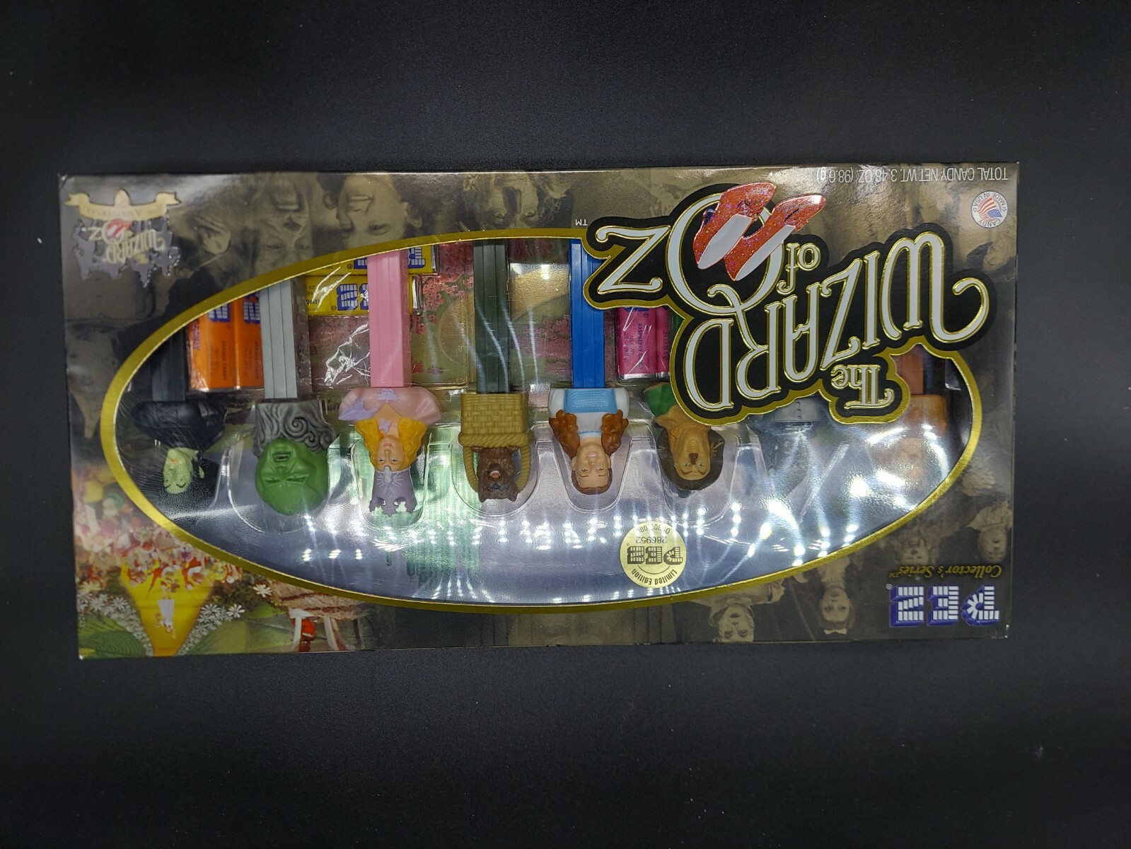 Lot Of 5 Collectible “Wizard Of Oz” Lot. Game, Pez, Tumblers, Ornamental Bells