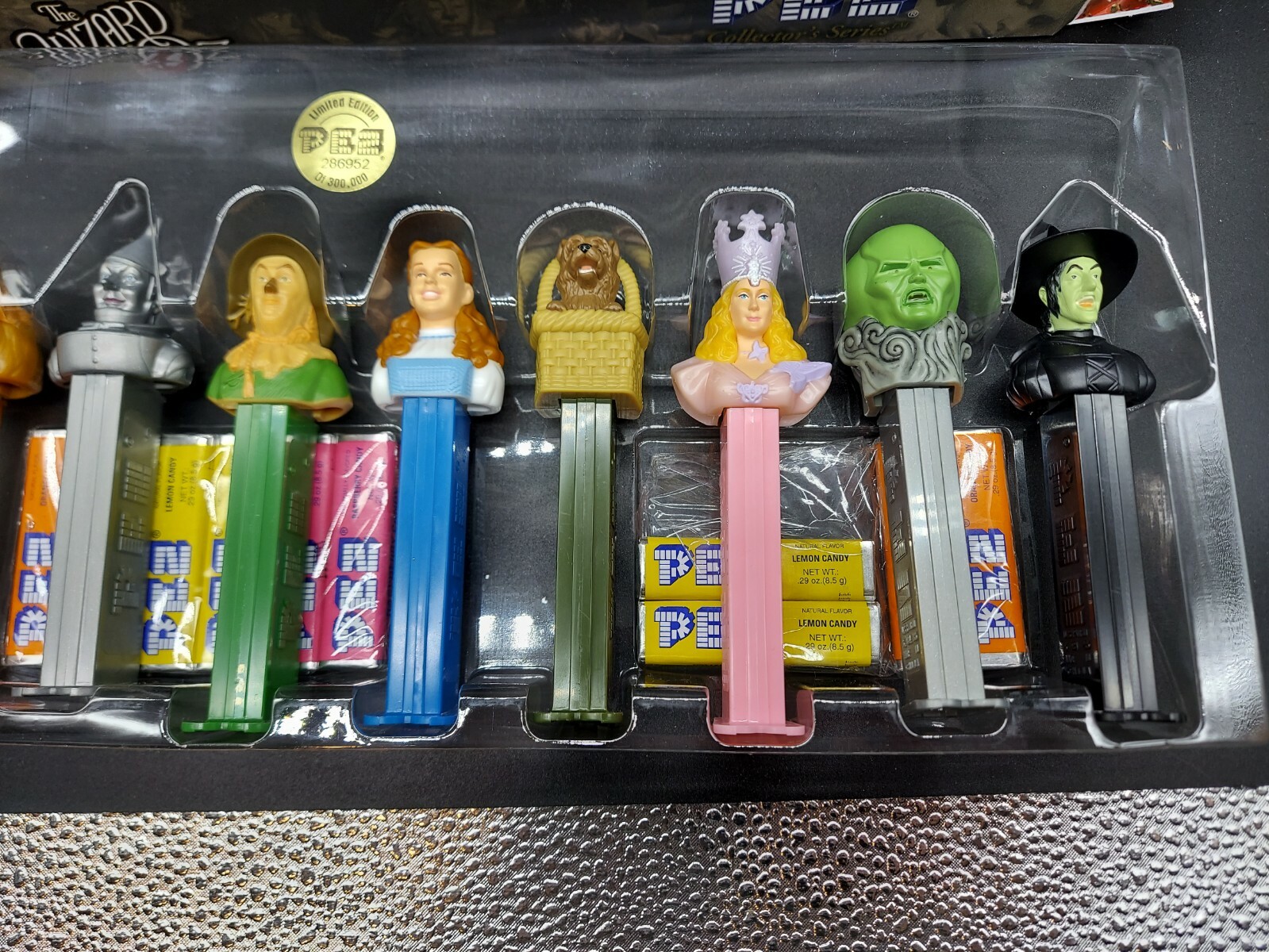Lot Of 5 Collectible “Wizard Of Oz” Lot. Game, Pez, Tumblers, Ornamental Bells